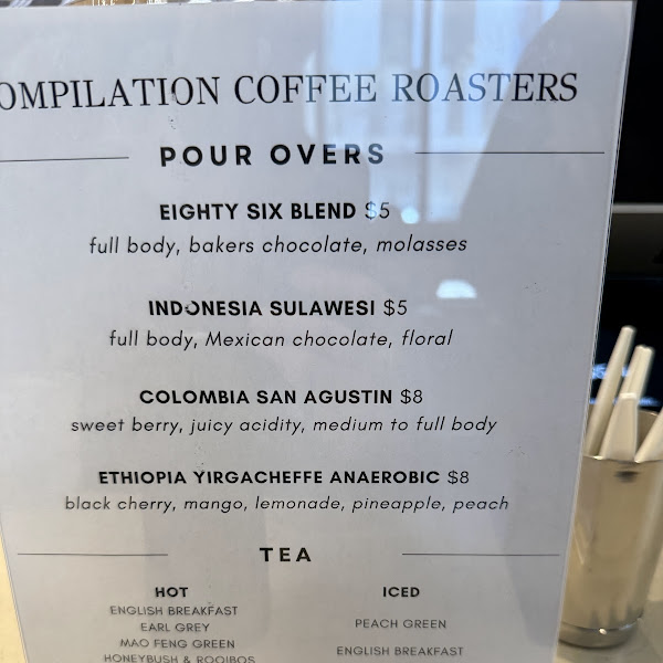 A barista pulling a shot behind the bar